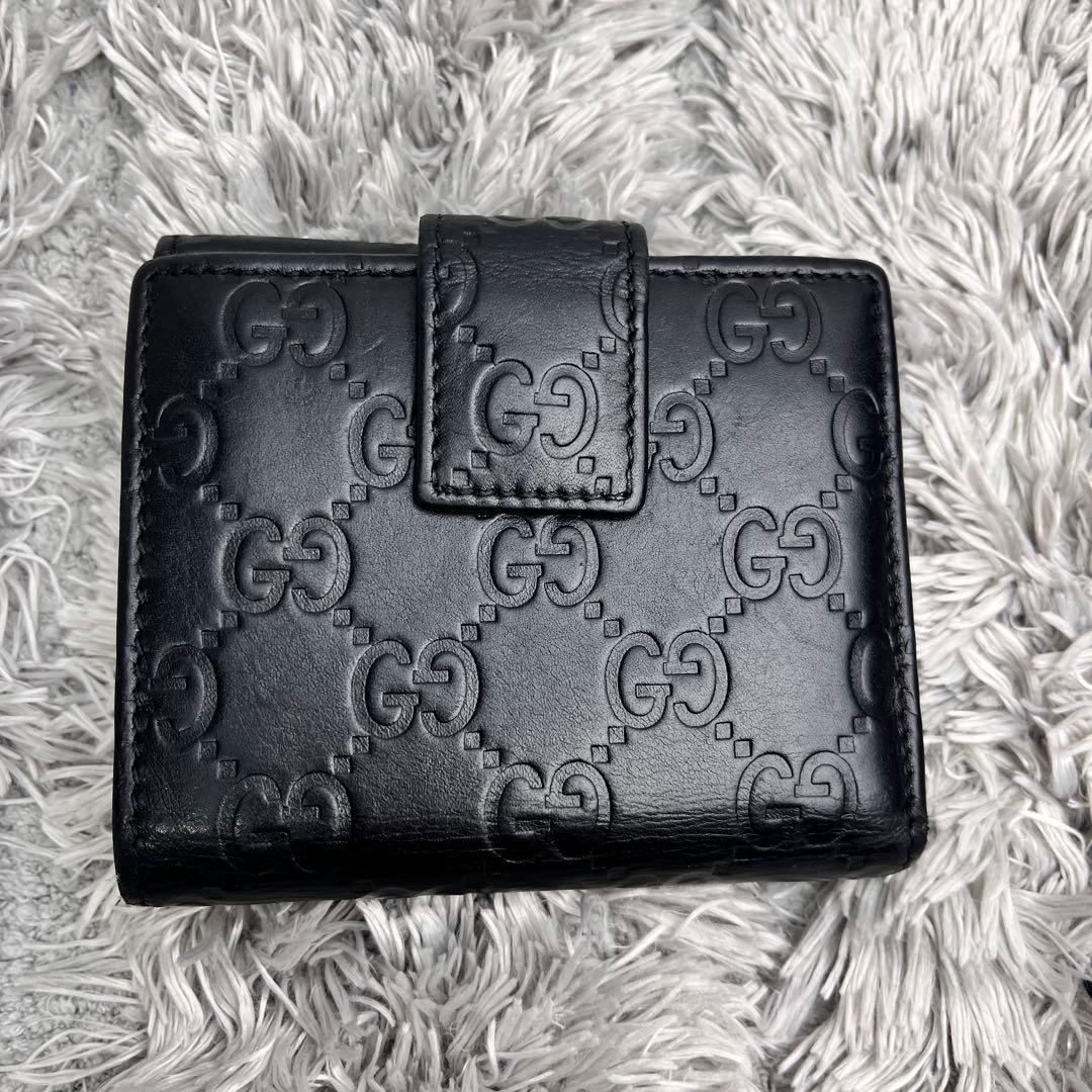 グッチ　シマ　折り財布　ロゴプレート　ブラック　　メンズ　レディース