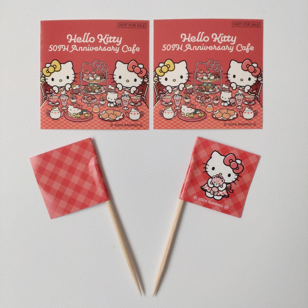 キティ 50周年記念カフェ 缶バッジ 巾着 ステッカー ショッパー