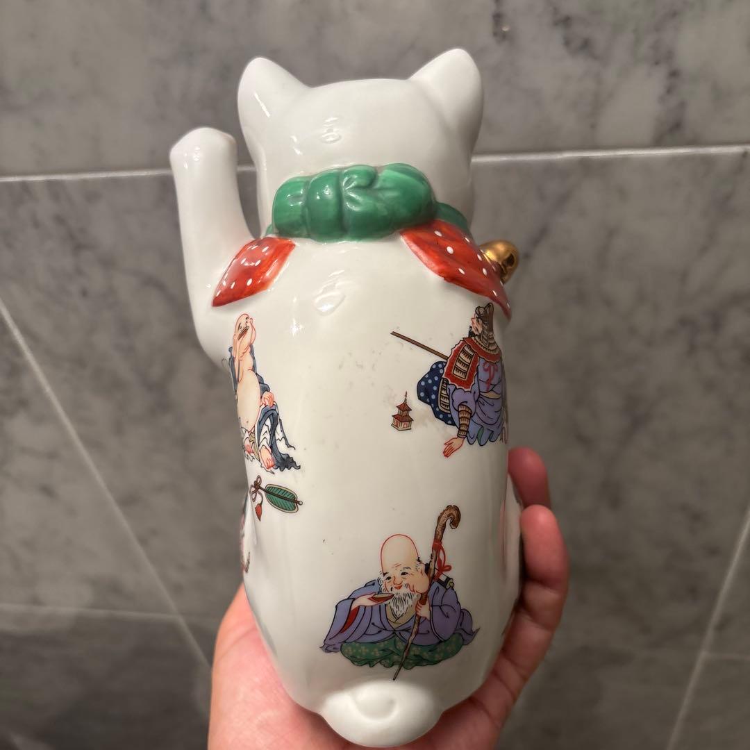 ヴィンテージ縁起の良い七福神が描かれ、可愛らしい瞳の招き猫