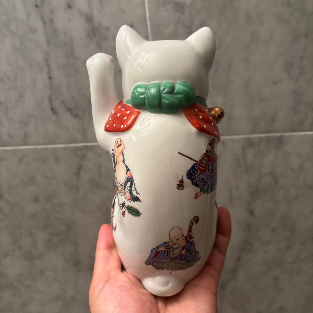 ヴィンテージ縁起の良い七福神が描かれ、可愛らしい瞳の招き猫