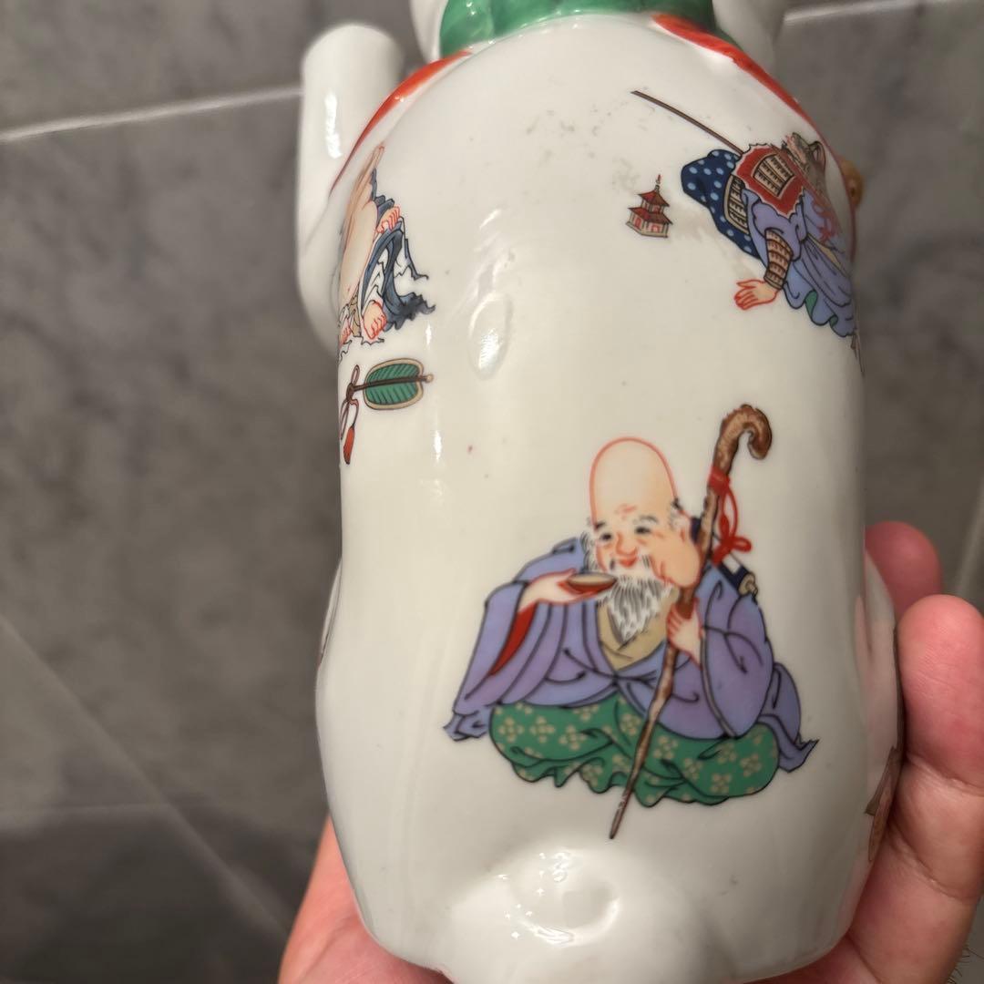 ヴィンテージ縁起の良い七福神が描かれ、可愛らしい瞳の招き猫