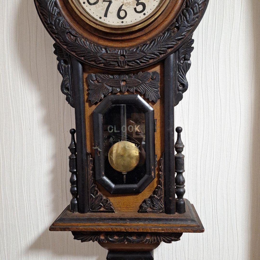 324 彫刻入り振り子掛時計　小型ひまわり柱時計