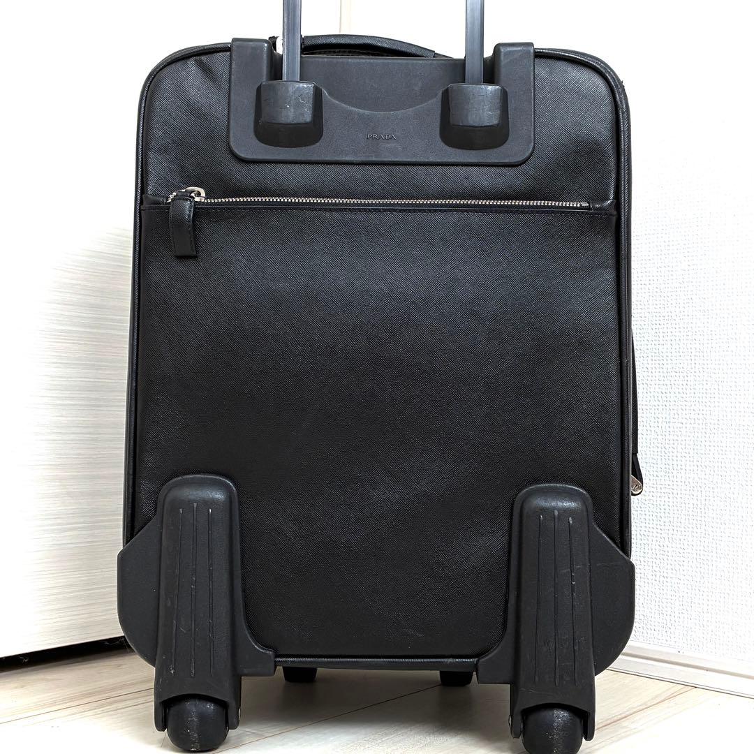 正規品 プラダ キャリーケース 三角ロゴ 白タグ サフィアーノレザー メンズ 黒