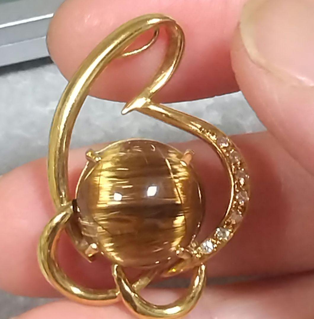 14.50ブラウンルチルキャッツアイダイヤ0.07入りk18ペンダントトップ