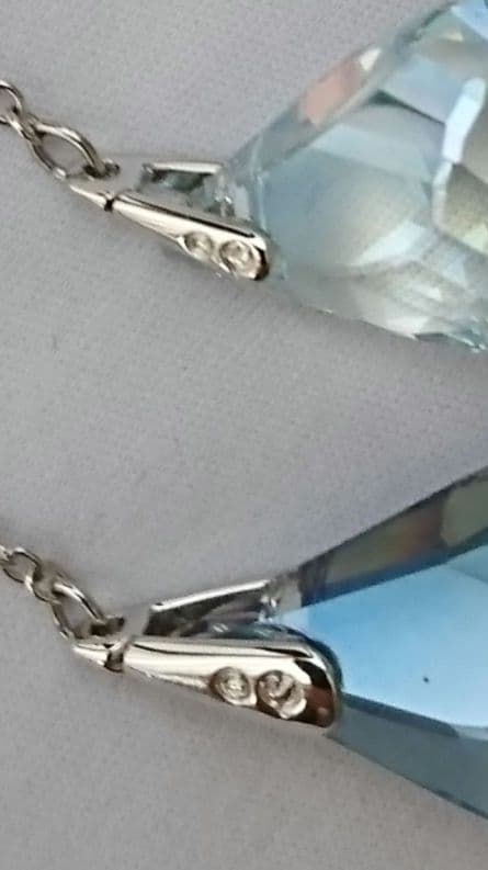 v*v様 購入に責任の持てる方のみSwarovski フープ ドロップアシンメト