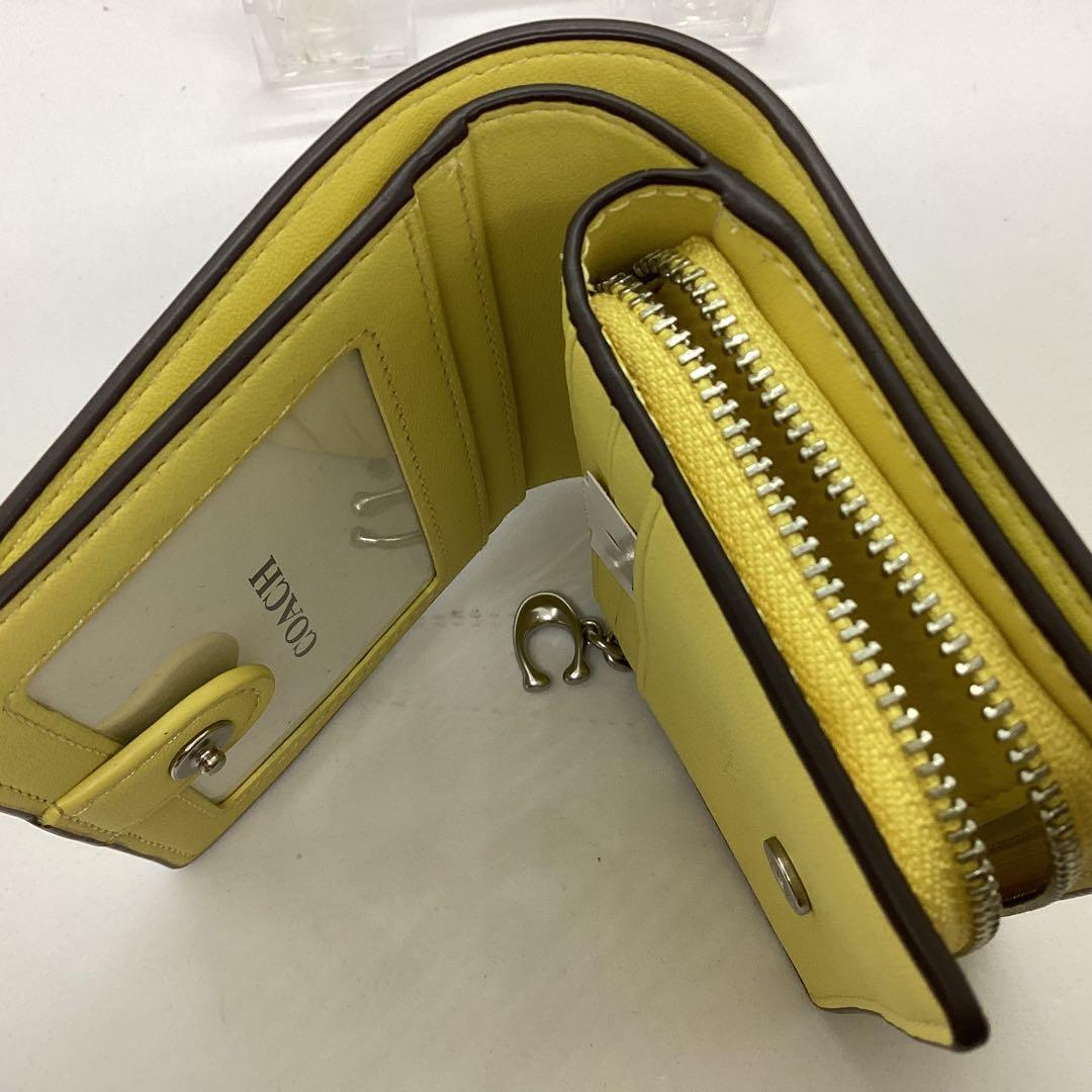 COACH 花柄 二つ折り　コンパクト　財布 イエロー