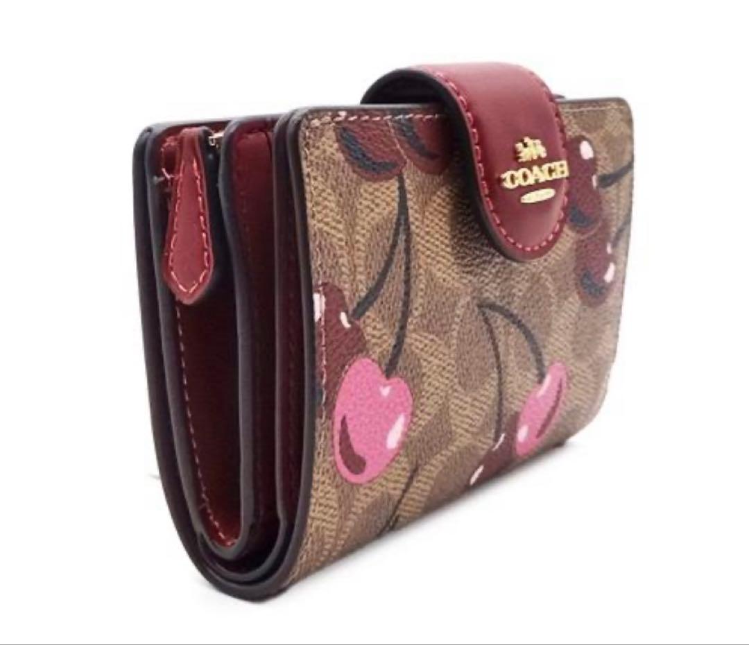 COACH 二つ折り財布 シグネチャー チェリー柄 CZ342