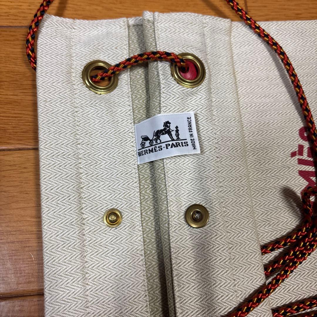 HERMÈS エルメス 巾着ポーチ ロゴ入り 紐付き ベージュ系