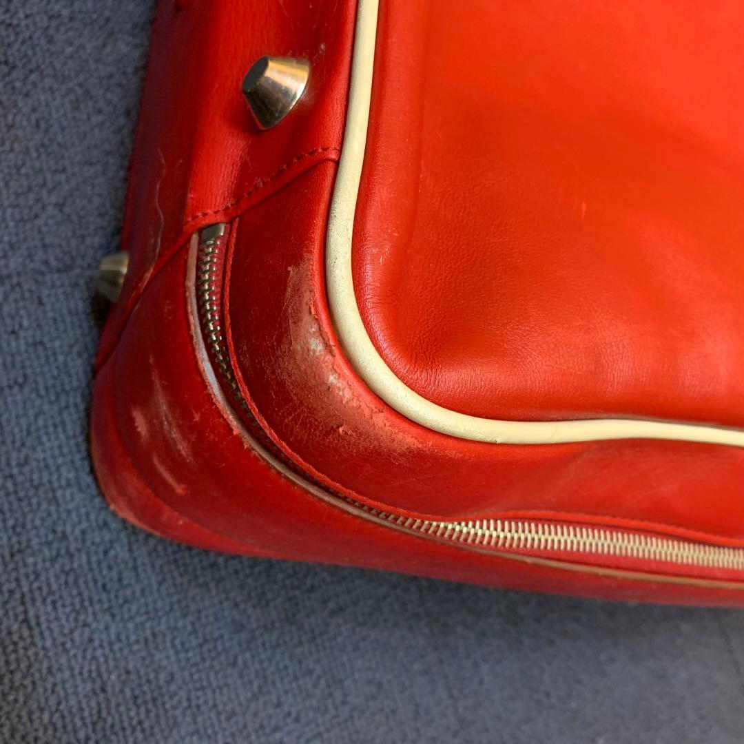 プラダ　PRADA トラベルバッグ　旅行用　スーツケース　赤　レッド　プレート