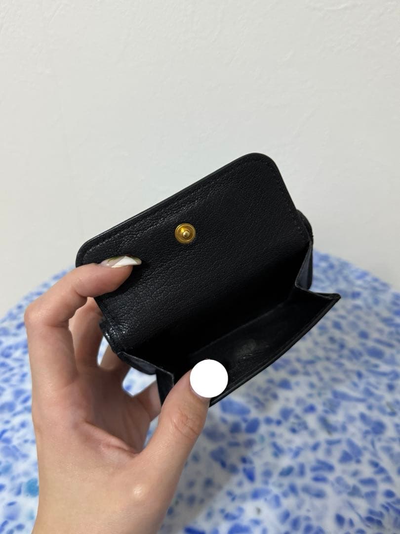 MIU MIUの三つ折り財布 ブラック 黒
