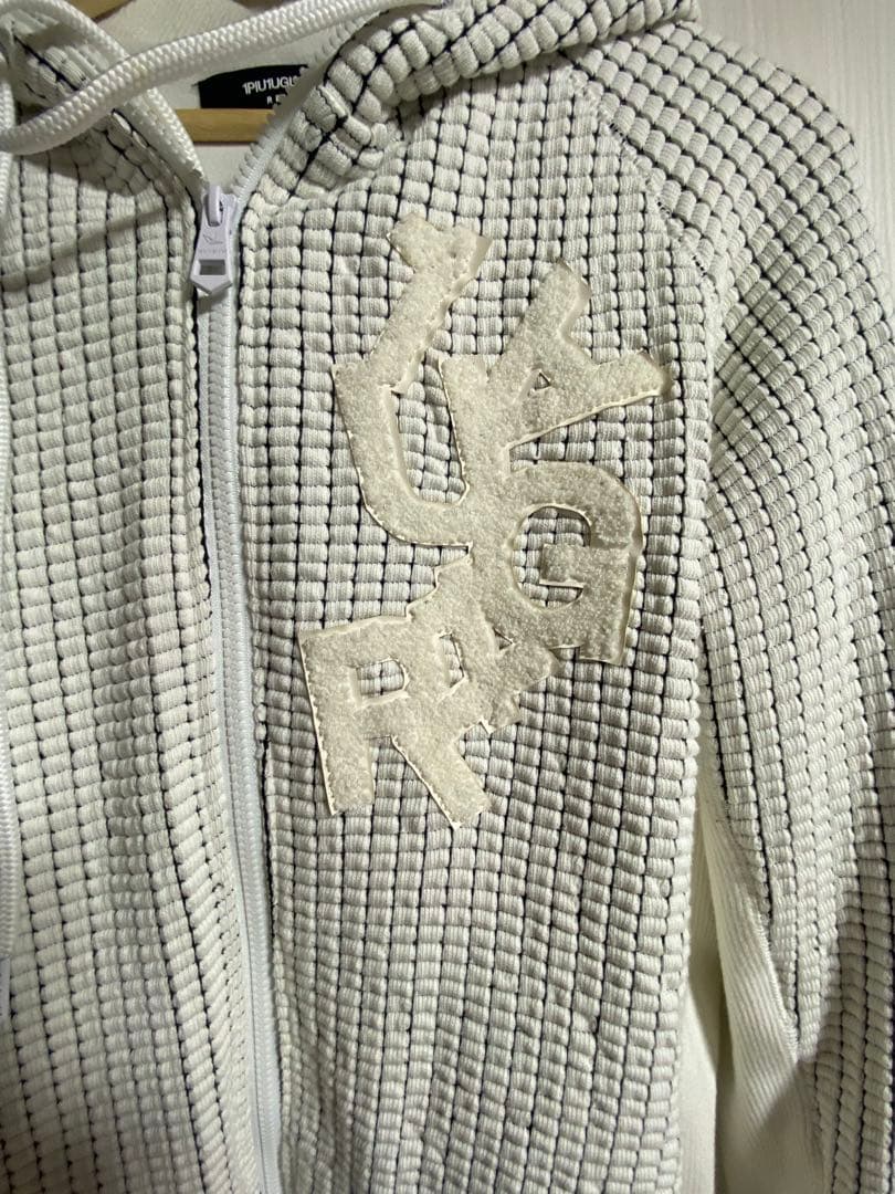 1PIU1UGUALE3 RELAX ランダムロゴワッフルリブパーカー