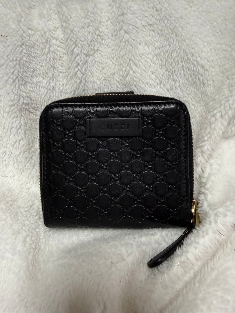 未使用GUCCI 二つ折り財布 ロゴプレート マイクロGG シマレザー 黒