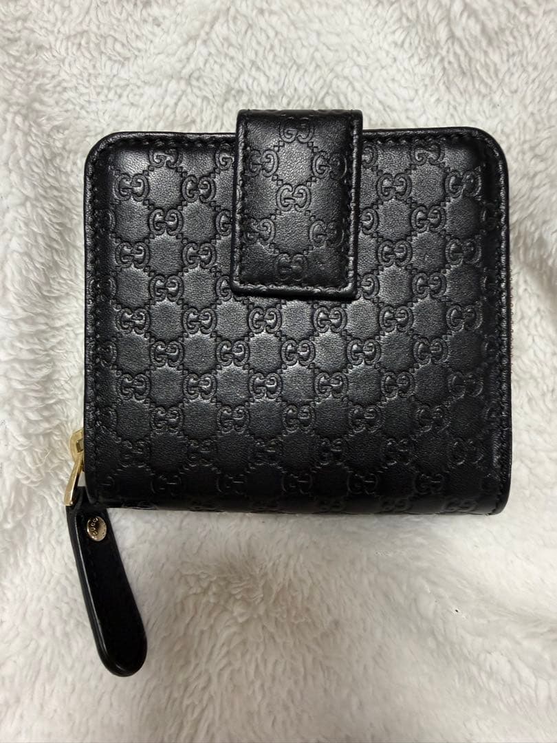 未使用GUCCI 二つ折り財布 ロゴプレート マイクロGG シマレザー 黒