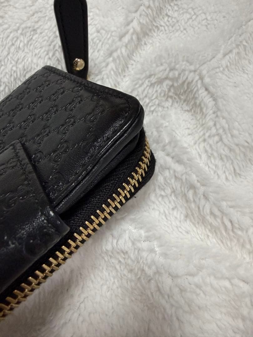 未使用GUCCI 二つ折り財布 ロゴプレート マイクロGG シマレザー 黒