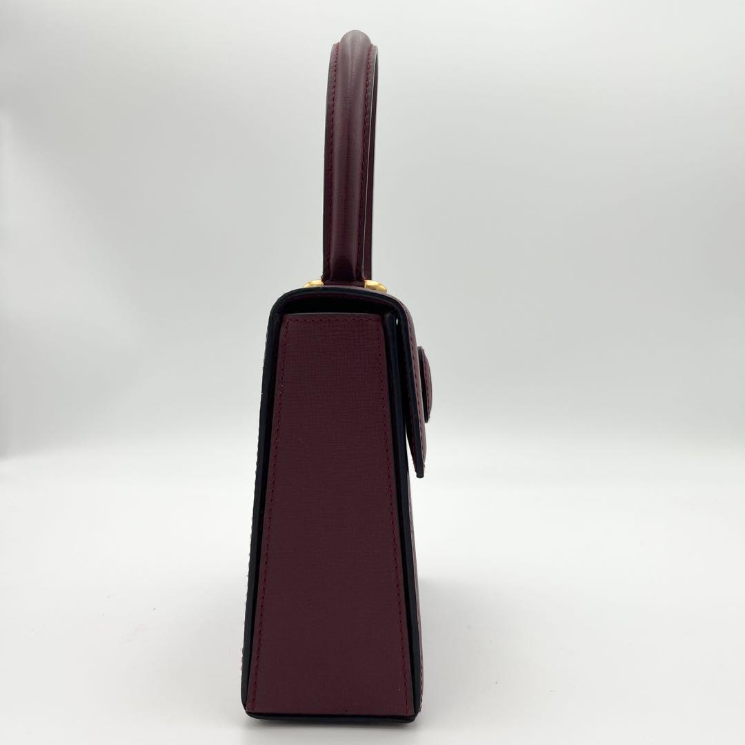 カルテイェ マストライン ターンロック ボックスカーフ ミニハンドバッグ 総柄