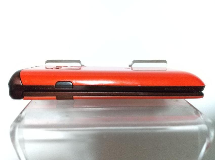 GRATINA KYY06 折りたたみ式携帯電話 オレンジ